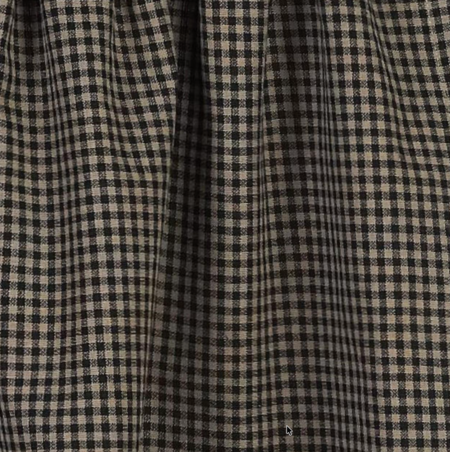Close-up of a checkered fabric with black and beige pattern