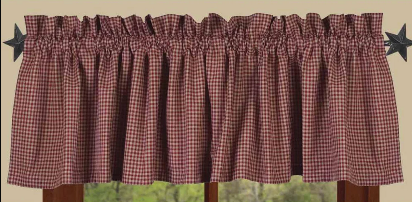 Plaid curtain valance with star decorations on a neutral background