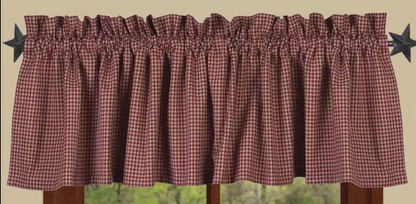 Plaid curtain valance with star decorations on a neutral background