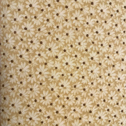 A close-up of a fabric or wallpaper pattern featuring small white daisy flowers and dark brown dots on a warm beige background.