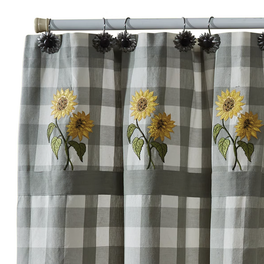 Checkered curtain with sunflower embroidery on a gray background